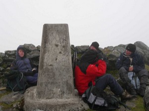 Walkers sheltering from the wind