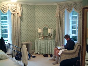 Andrew writing up his diary in the Princess Anne room