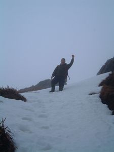 Andrew trekking up the snow