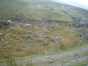 The cairn marking the way up